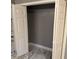 Empty closet with white folding doors and marble flooring ready for storage solutions at 471 Tipton Dr, Riverdale, GA 30274