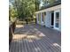 A backyard wooden deck with double doors, wooden shutters and ornate railing at 471 Tipton Dr, Riverdale, GA 30274