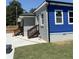 Newly renovated exterior featuring gray brick, blue siding, and wooden railings at 471 Tipton Dr, Riverdale, GA 30274