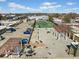 Aerial view of the rooftops with seating areas and tennis court, enhancing the community's appeal at 5300 Peachtree Rd # 3507, Chamblee, GA 30341