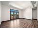 Bright living room with wood-style floors and a large window with a view at 5300 Peachtree Rd # 3507, Chamblee, GA 30341