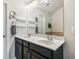 The home features an updated bathroom with a large mirror and a dual sink dark wood vanity at 7420 Glisten Ave, Sandy Springs, GA 30328