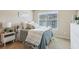 A serene bedroom with natural light highlights modern design and decor at 7420 Glisten Ave, Sandy Springs, GA 30328