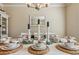 Nicely decorated dining table featuring a decorative centerpiece with plates, bowls, and rattan placemats at 7420 Glisten Ave, Sandy Springs, GA 30328