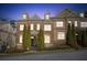 Charming brick townhome featuring manicured landscaping and classic architectural details at 7420 Glisten Ave, Sandy Springs, GA 30328
