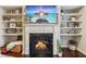 Elegant fireplace with built-in shelves, hardwood floors, and stylish decor at 7420 Glisten Ave, Sandy Springs, GA 30328