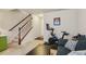 This flex space with exercise equipment features comfortable seating, stairs, and neutral paint at 7420 Glisten Ave, Sandy Springs, GA 30328