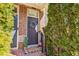 Inviting front entrance with a welcoming wreath, charming decor, and a brick-paved walkway at 7420 Glisten Ave, Sandy Springs, GA 30328