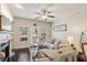 Cozy living room with fireplace, built-in shelves, hardwood floors, and ample seating at 7420 Glisten Ave, Sandy Springs, GA 30328