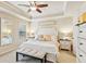 Inviting primary bedroom with tray ceiling, neutral decor, and comfortable furnishings at 7420 Glisten Ave, Sandy Springs, GA 30328