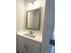Modern bathroom featuring a white vanity with a sleek countertop and stylish mirror at 5455 Blossomwood Sw Trl, Mableton, GA 30126