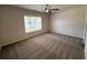 Bright bedroom with a ceiling fan and large window at 5455 Blossomwood Sw Trl, Mableton, GA 30126