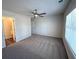 Large bedroom features a ceiling fan and a connecting door to a full bathroom at 5455 Blossomwood Sw Trl, Mableton, GA 30126