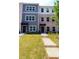 Exterior view showcasing the townhouses, front yards, and walkways at 5455 Blossomwood Sw Trl, Mableton, GA 30126