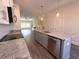 Modern kitchen island with granite countertops and stainless steel appliances at 5455 Blossomwood Sw Trl, Mableton, GA 30126