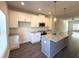 Bright, open-concept kitchen with modern appliances, white cabinets, and pendant lighting at 5455 Blossomwood Sw Trl, Mableton, GA 30126