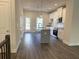 Modern kitchen with an island, white cabinets, and stainless steel appliances at 5455 Blossomwood Sw Trl, Mableton, GA 30126