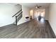 Spacious open-concept living area with fireplace and stairway at 5455 Blossomwood Sw Trl, Mableton, GA 30126