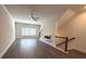 Bright living room with large windows and ceiling fan at 5455 Blossomwood Sw Trl, Mableton, GA 30126