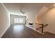 Spacious living room with modern ceiling fan, decorative fireplace and large window at 5455 Blossomwood Sw Trl, Mableton, GA 30126