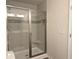 Modern shower with glass door and custom tile at 5455 Blossomwood Sw Trl, Mableton, GA 30126