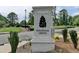 Elegant Magnolia Grove entrance sign with professional landscaping and community charm at 5455 Blossomwood Sw Trl, Mableton, GA 30126