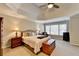 Spacious main bedroom featuring a tray ceiling, large window, and neutral color palette at 3743 Heathermoor Ct, Dacula, GA 30019