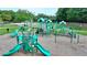 Community playground features slides, climbing structures, and green safety turf at 3743 Heathermoor Ct, Dacula, GA 30019