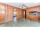 Spacious room with wood paneled walls and unique flooring at 557 Watson Ferry Dr, Forest Park, GA 30297