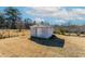 Backyard showing an old shed to store outdoor tools and equipment on a sunny day at 557 Watson Ferry Dr, Forest Park, GA 30297