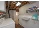 Laundry area in basement with storage and shelving at 8321 Banks Mill Rd, Douglasville, GA 30135