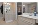 Bathroom with double sink vanity and walk-in closet at 8321 Banks Mill Rd, Douglasville, GA 30135