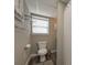 Cozy bathroom featuring modern fixtures, wood-look flooring, and neutral decor at 8321 Banks Mill Rd, Douglasville, GA 30135