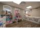 Bedroom features hardwood floors, a bed, vanity, and play area at 8321 Banks Mill Rd, Douglasville, GA 30135