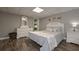 Bedroom boasts hardwood floors, a comfortable bed, and stylish decor at 8321 Banks Mill Rd, Douglasville, GA 30135
