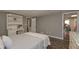 Bedroom with hardwood floors, bed, and a white desk at 8321 Banks Mill Rd, Douglasville, GA 30135
