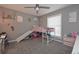Secondary bedroom with loft bed, fan, and large window providing natural light at 8321 Banks Mill Rd, Douglasville, GA 30135