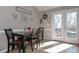Bright dining area with access to the outdoor deck through double doors at 8321 Banks Mill Rd, Douglasville, GA 30135