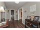 Well-lit entryway with hardwood floors and charming decor accents at 8321 Banks Mill Rd, Douglasville, GA 30135