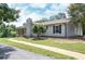 Home with stone chimney, manicured landscaping, an outbuilding and paved walkway from the driveway at 8321 Banks Mill Rd, Douglasville, GA 30135