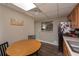Charming kitchen nook featuring a cozy dining area with table and dark wood flooring at 8321 Banks Mill Rd, Douglasville, GA 30135