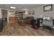 Spacious room with hardwood floors, a couch, desk, and wall decor at 8321 Banks Mill Rd, Douglasville, GA 30135