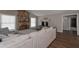 Comfortable living room featuring a stone fireplace and large windows at 8321 Banks Mill Rd, Douglasville, GA 30135
