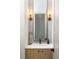 Stylish bathroom featuring a modern vanity, sleek fixtures, and a beautifully framed mirror with sconces at 1290 Lupo Loop, Chattahoochee Hills, GA 30268
