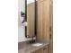 Elegant bathroom featuring a stylish vanity with modern fixtures and ample storage at 1290 Lupo Loop, Chattahoochee Hills, GA 30268
