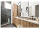 Bright bathroom with a double sink vanity and a large glass enclosed shower at 1290 Lupo Loop, Chattahoochee Hills, GA 30268