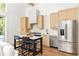 Stylish kitchen with island seating, modern appliances, and sleek cabinetry at 1290 Lupo Loop, Chattahoochee Hills, GA 30268