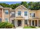 Inviting two-story townhome featuring mixed siding and manicured front lawn at 2838 Vining Ridge Ter # 0, Decatur, GA 30034