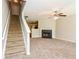 Open living area with fireplace, stairs, and a ceiling fan at 2838 Vining Ridge Ter # 0, Decatur, GA 30034