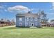 Spacious backyard with lush green grass and a two-story house at 474 Maxwell Rd, Roswell, GA 30075